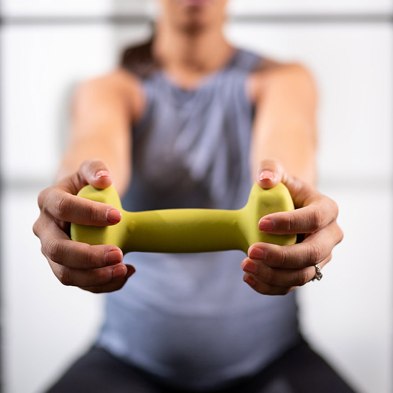 Pregnant woman holding weight