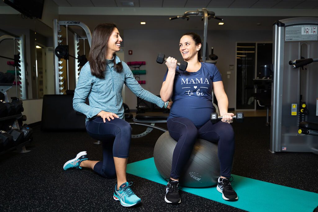 Patient working with a provider at a postpartum physical therapy clinic in Boston, MA