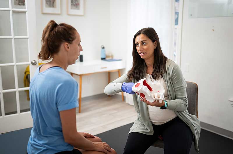 Patient working with a provider at a pelvic floor physical therapy clinic in Boston, MA